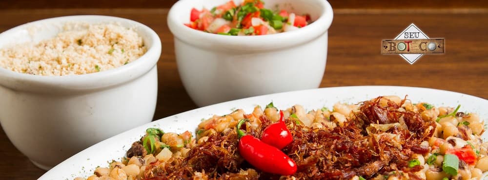 Tapas e frutos do mar, além de cervejas e caipirinhas, em bar e restaurante contemporâneo e descontraído.