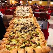 Rodízio de pizzas e massas, além de petiscos e chopes, em espaço amplo e descontraído, com tevês e playground.
